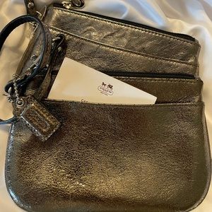 Coach metallic wristlets or little wallet